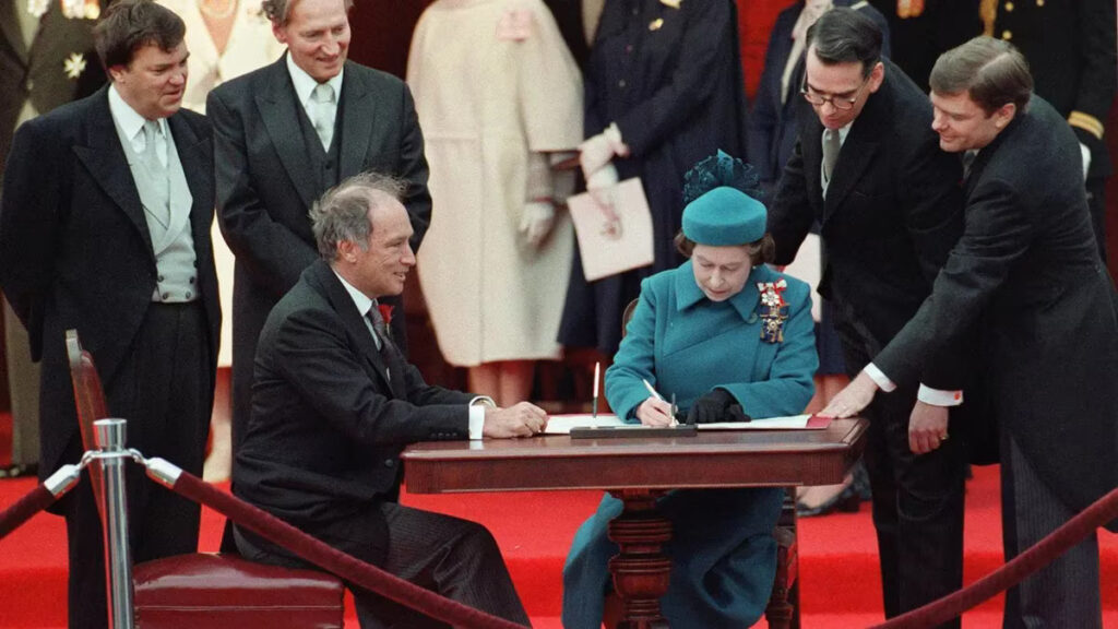 Queen and Trudeau signing Charter of  Rights and Freedoms